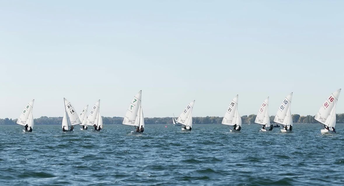 A fleet of sailboats racing on open water